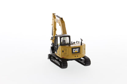CAT 309 mini excavator with bucket attachment