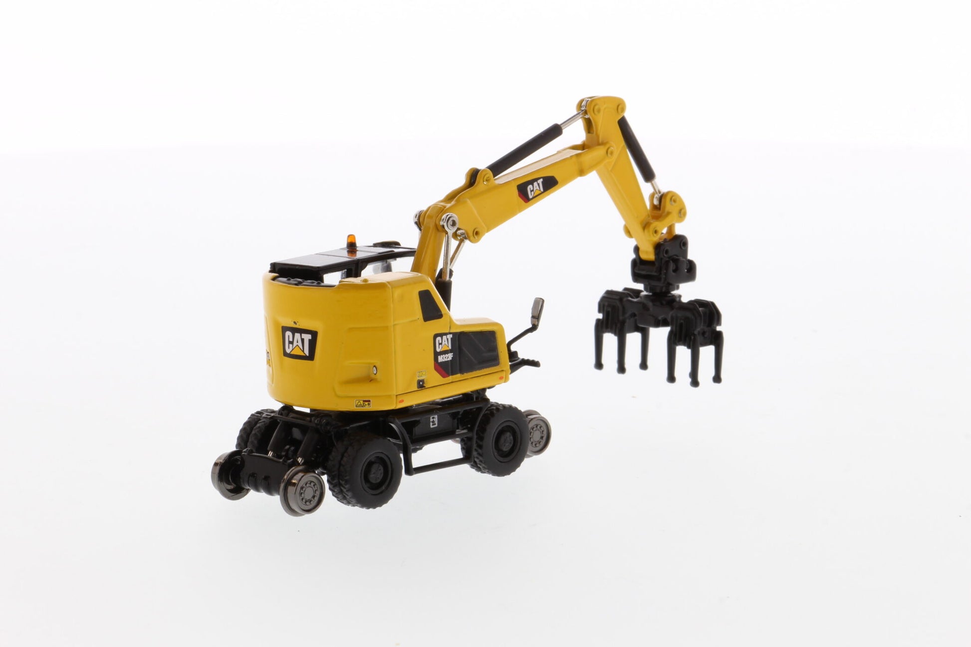 CAT M323F Safety Yellow HO rail wheel