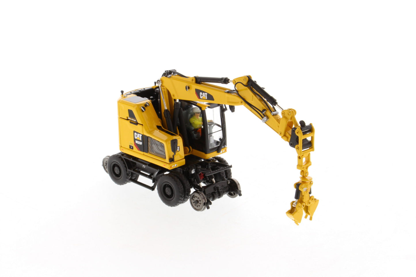 CAT M323F Safety Yellow with clamshell bucket